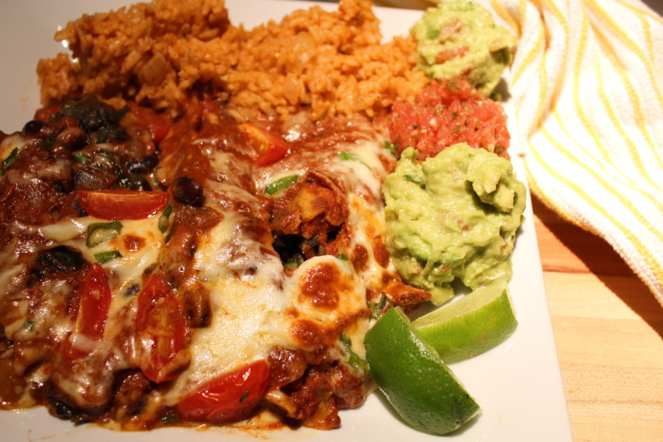 meatless mondays: black bean and spinach enchiladas https://karissapwellness.com/2017/01/black-bean-spinach-enchiladas/