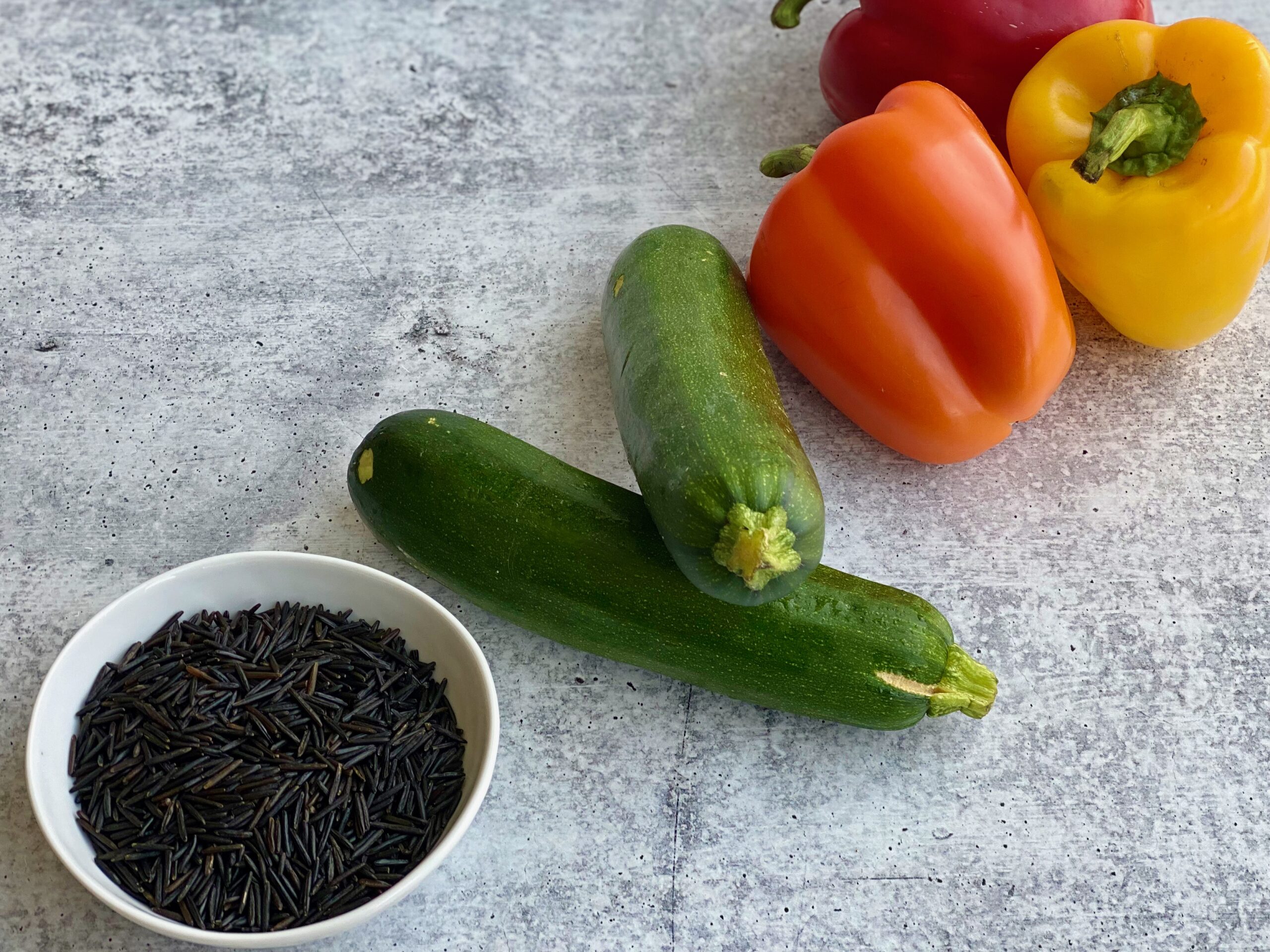 one pan unstuffed bell peppers An image of rice, zucchini and bell peppers