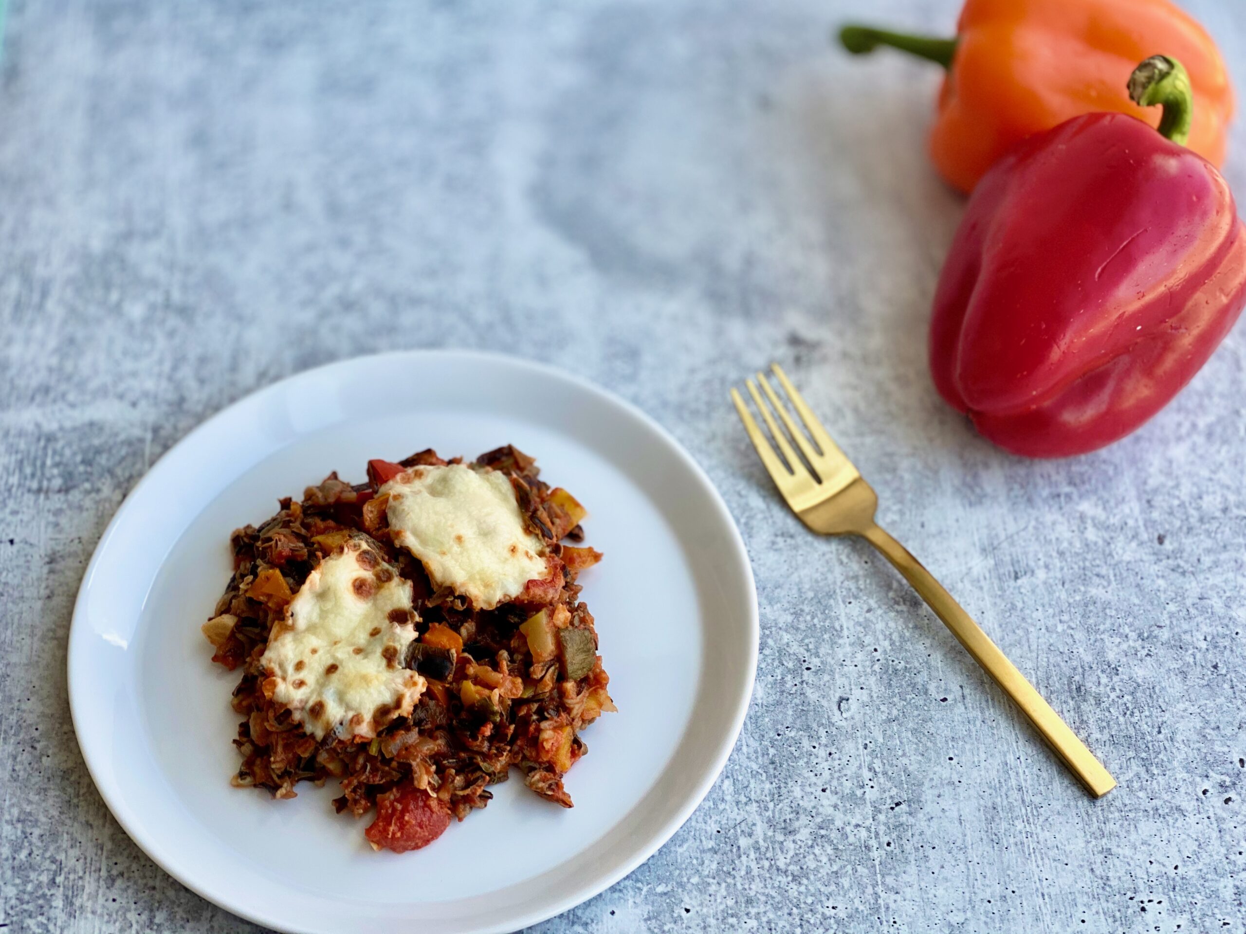 one pan unstuffed bell peppers An image of a plate of stuffed peppers with bell peppers in the background