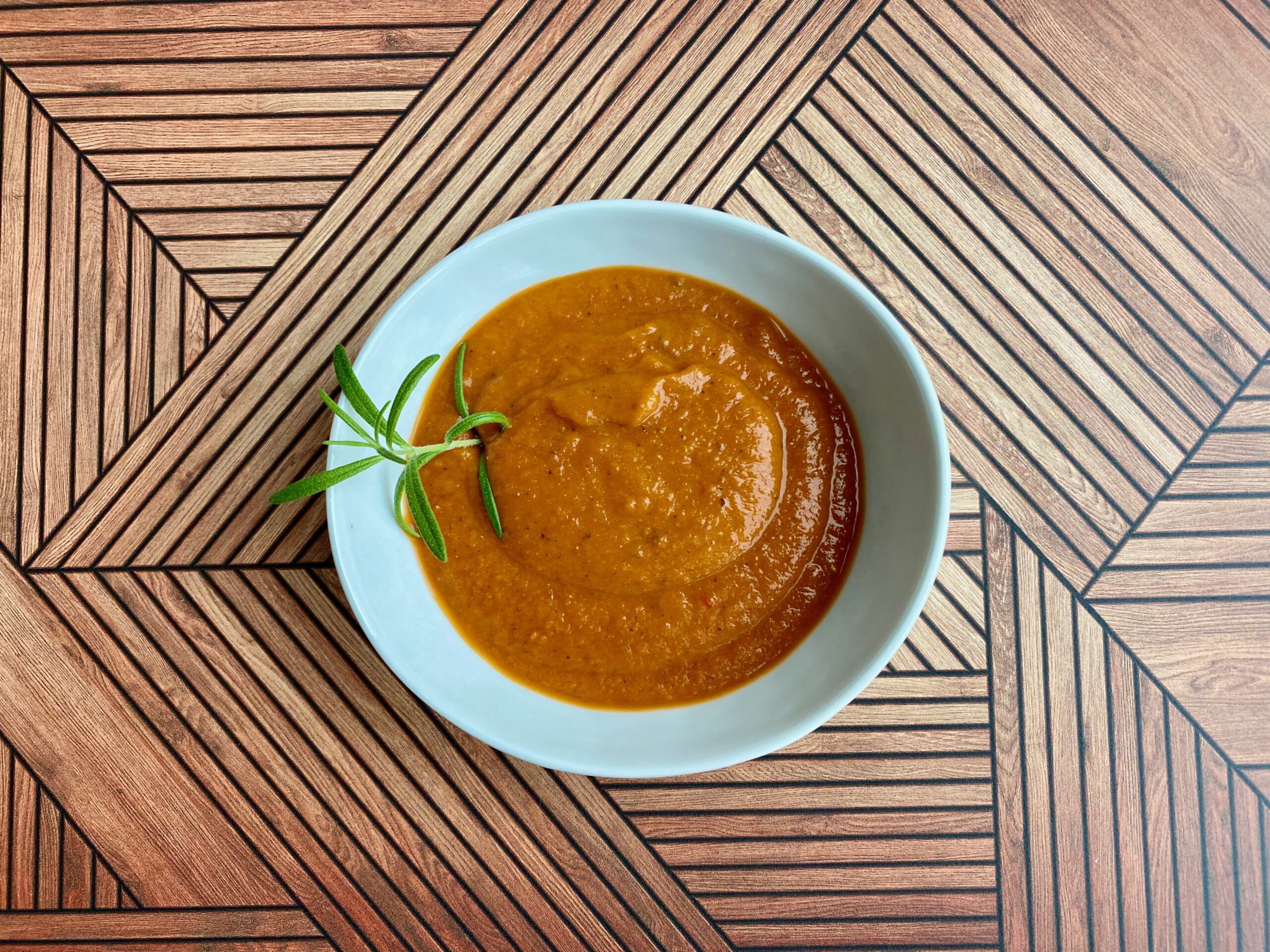 Easy Roasted Tomato Vegetable Soup An image of a bowl full of tomato soup