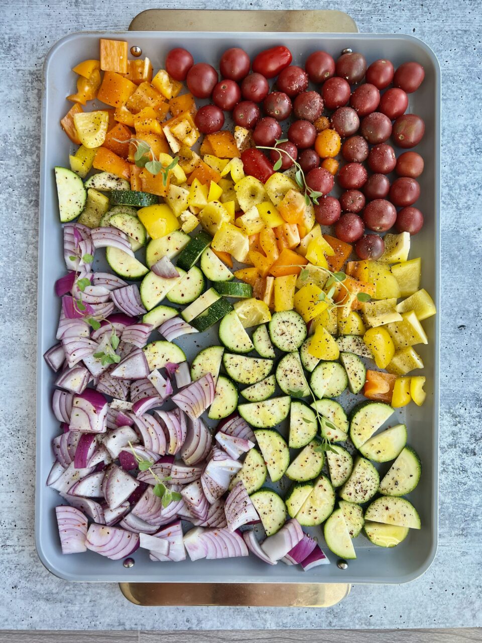 Vegetarian Greek Bowls with Halloumi A cookie sheet with colorful vegetables